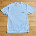 Light blue t-shirt with 'wichita' text on a wooden floor